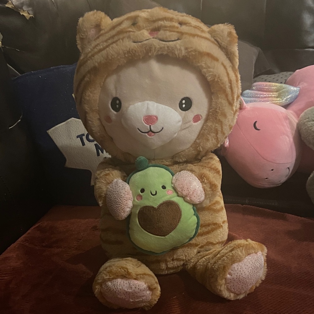 Adorable Brown Plush Toy with Avocado